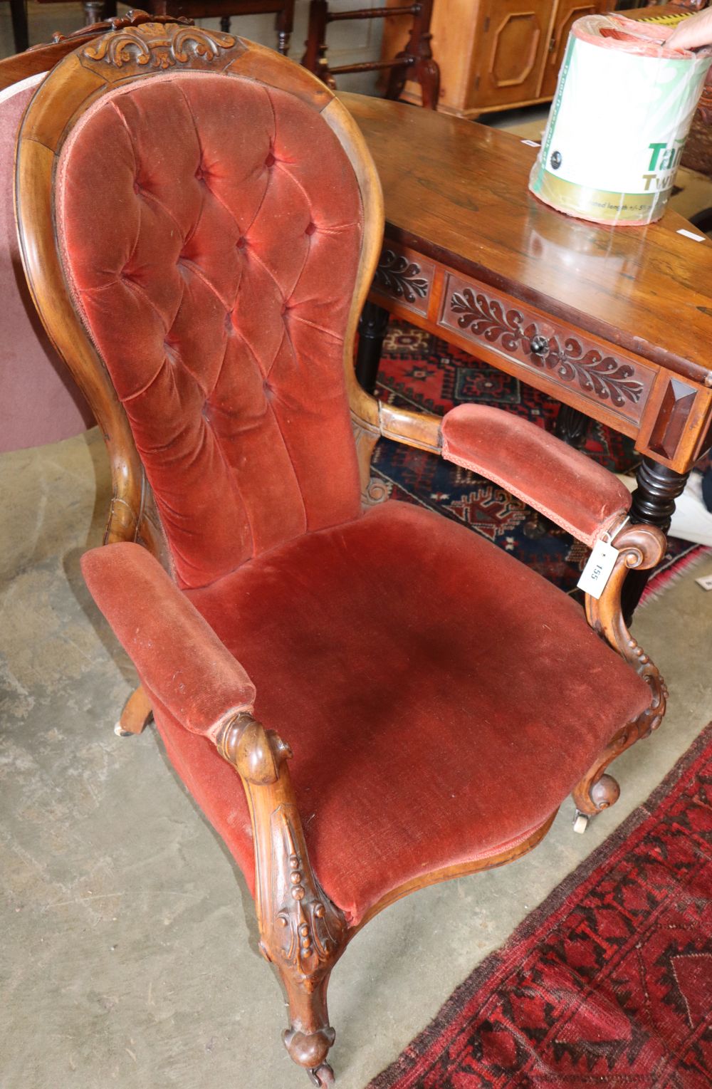 A Victorian mahogany spoonback armchair